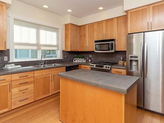 Ample cabinet space, stainless steel appliances, gas stove