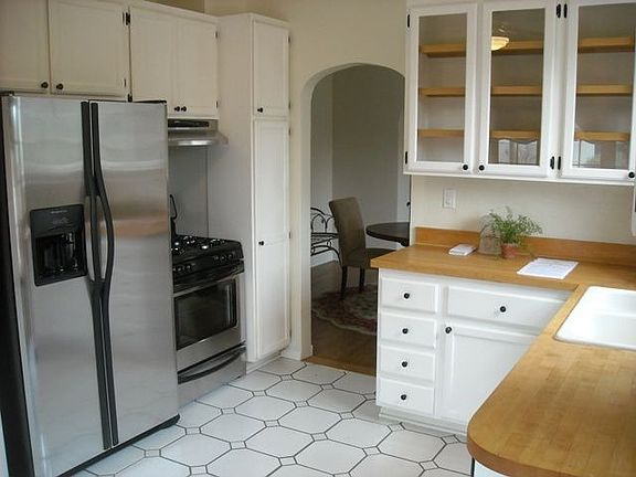 Kitchen leads to Dining