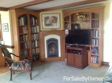 Fireplace, books, TV in family room