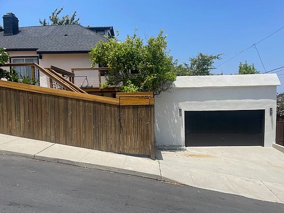 Exterior garage view with on and off-street parking