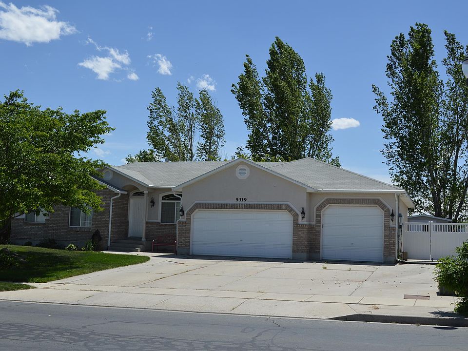 Exterior photo - note fully fenced yard with swing gate.