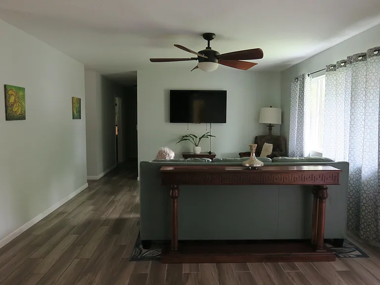 A large living room for relaxing, watching TV, reading, or conversation.