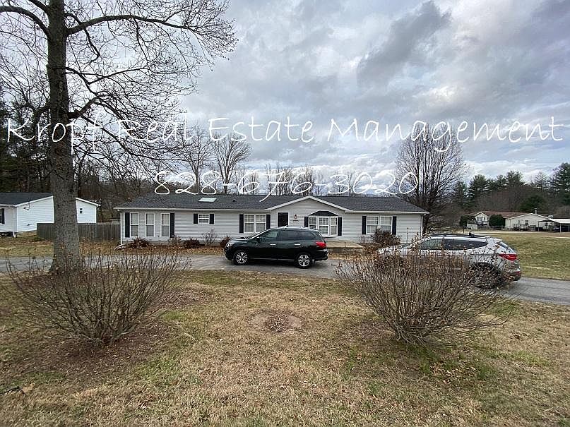 Front of house with circle driveway