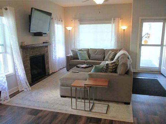 Bright & Airy Living Room with Fireplace (View from Dining Room)