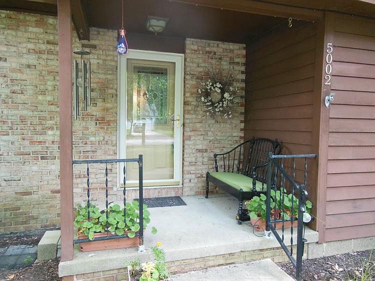 A welcoming porch is always nice and this one is graced by a new front door.