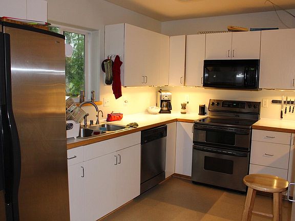 Kitchen with stainless steel appliances.