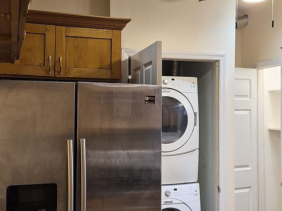 Refrigerator with water dispenser/ice maker. In-unit washer & dryer. Pantry. Dishwasher (not pictured)