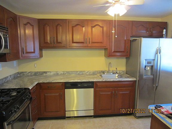 Kitchen- looking in from the dining room showing part of the ceiling fan & part of the island.