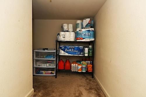 Storage underneath a stairway in the left side of entry hallway