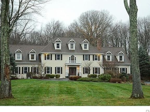 Symmetrical front of young Georgian colonial is impressive.