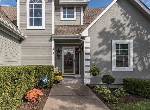 Wide walkway leads you to the front door.  Home freshly painted in September 2016!