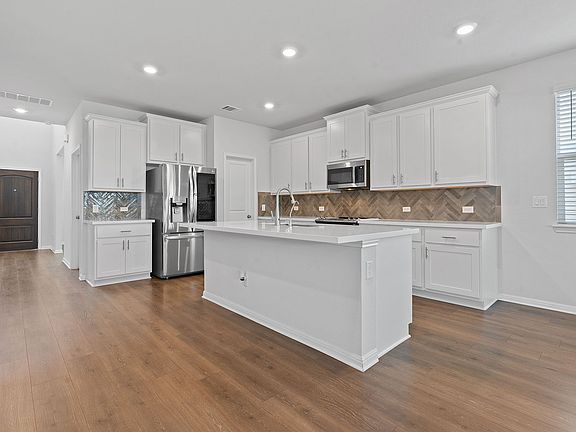 Hallway / Kitchen (First Floor): Quartz countertops and modern soft-close cabinets, A perfect space for cooking and entertaining. LG Instaview Refrigerator WI-FI.