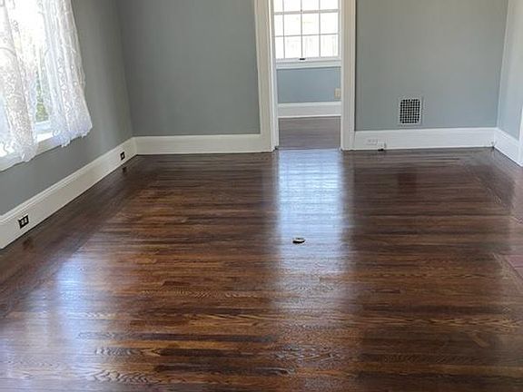 living room with wood burning fireplace