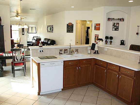 Another kitchen view also showing the large adjoining breakfast room.