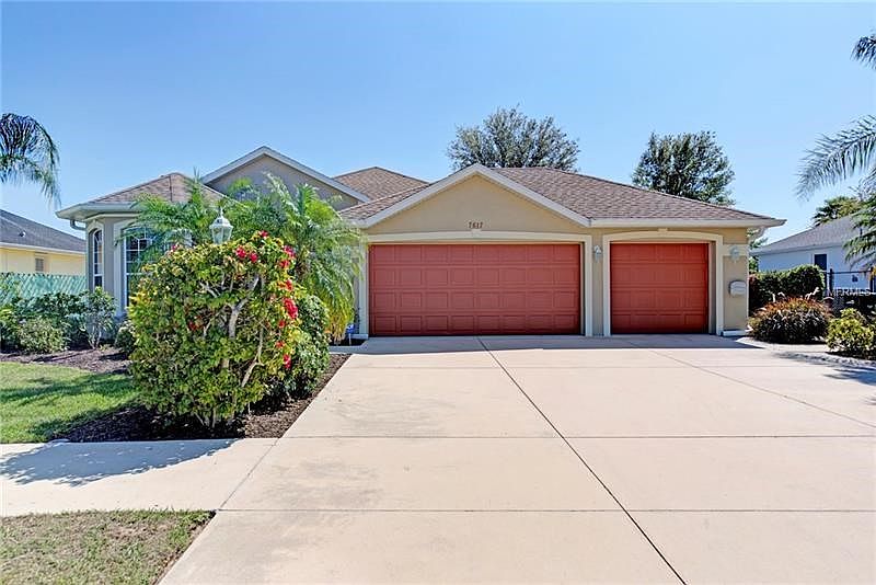 front elevation with extra wide driveway, LED Coach Lighting,& (30) yr shingles