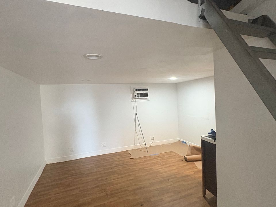 bedroom with storage or extra space on top