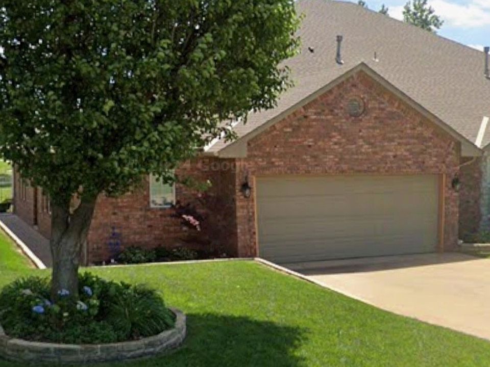 Beautiful curb appeal featuring a full two_car garage, mature tree, and neatly landscaped front yard.