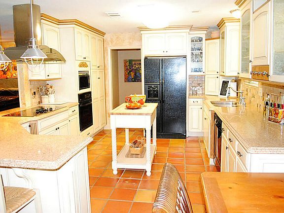 Another view of the kitchen. Notice the beautiful glass in layed cabinets.