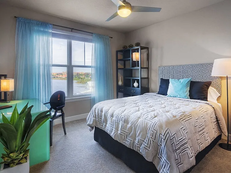 Bedrooms feature carpet and ceiling fans