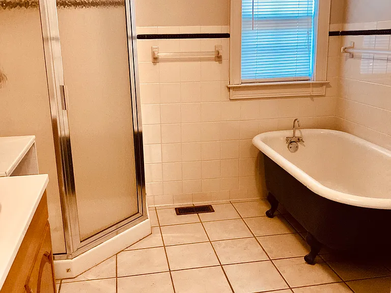 Common Bathroom with shower and clawfoot tub