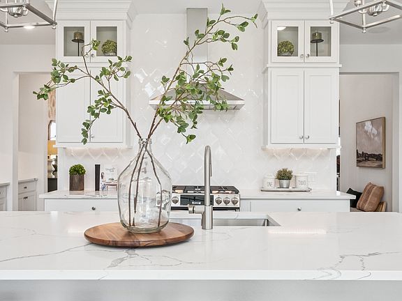Kitchen with full-height tile backsplash