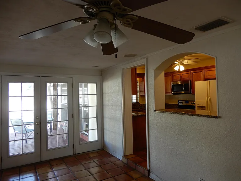 Great room or family room, natural clay sealed tiles and Pass- thru window from kitchen.