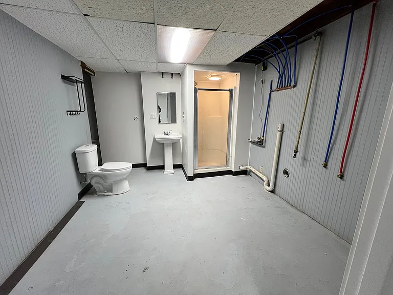 Full bathroom & laundry room combo in basement