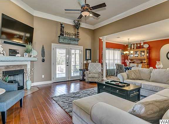 From foyer step into this spacious living room with corner fireplace with gas logs!