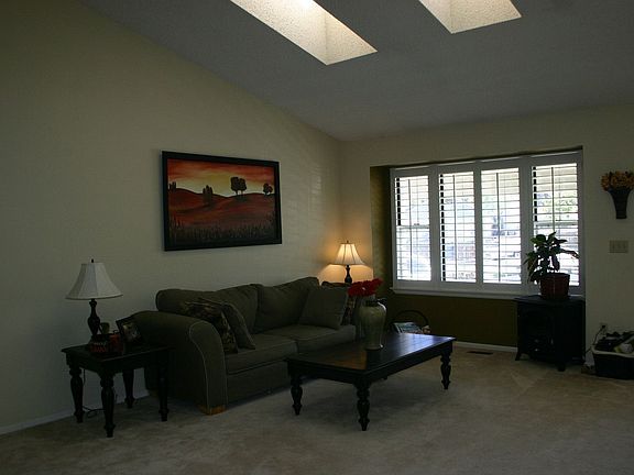 Great Room with Plantation Shutters and Skylights