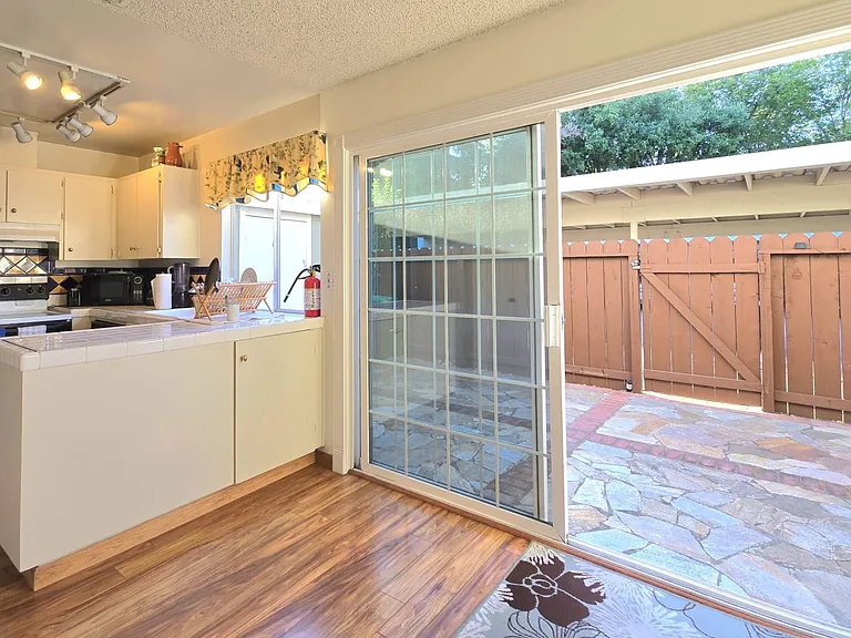 Kitchen and Dining area Open Up to Private Patio