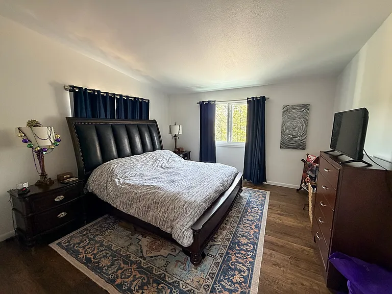 Upstairs Master bedroom with master bathroom. New windows, stunning views, hardwood floors