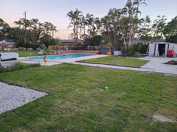 the back yard, pool and deck area
