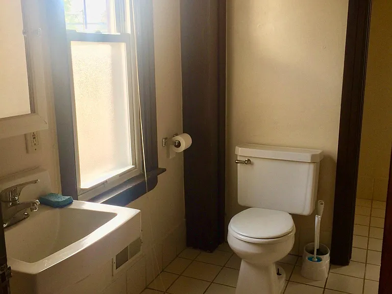 Large bathroom with plenty of natural light.