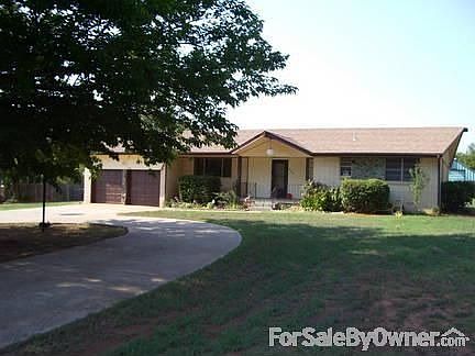 Front of House : There are 2 Big Oak Trees to the left of the pictures, with a circled driveway.