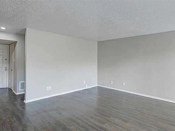 ANOTHER VIEW OF THE LIVING ROOM