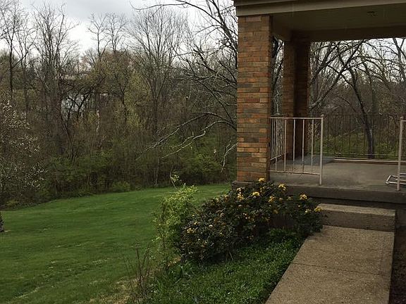 Covered side porch right outside kitchen
