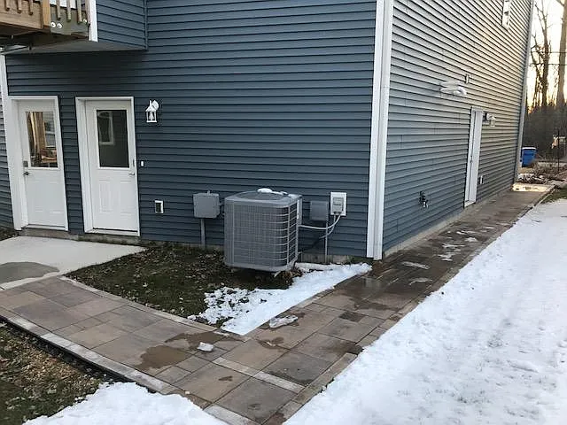 Walkway from the driveway to the main apartment entrance door (on the right).