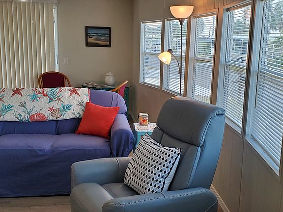 100% cotton couch cover is machine washable. Plenty of natural light from a bank of 6 front windows