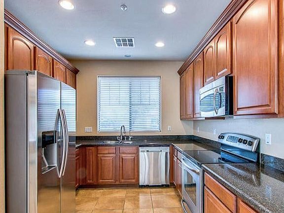 Stainless Steel Appliances with lots of Cabinet space with pantry.