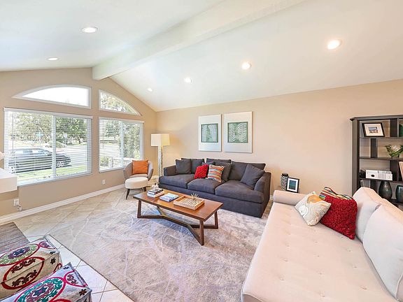 Living room with wood burning fireplace