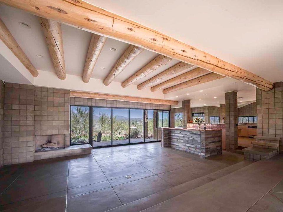 Open concept, with wall of windows and views