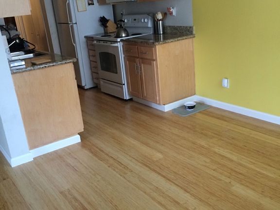 Dining room area with bamboo floors. Wall colors will be painted neutral colors