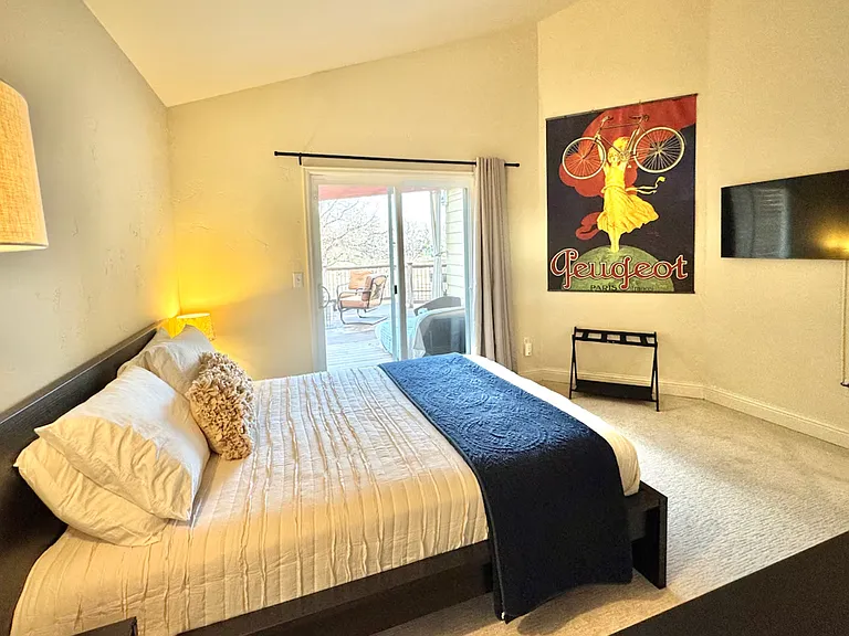 Bedroom #4: Main floor with adjacent bathroom, opens to backyard deck