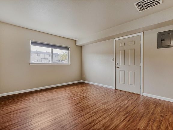 Bright living room with updated flooring and neutral finishes