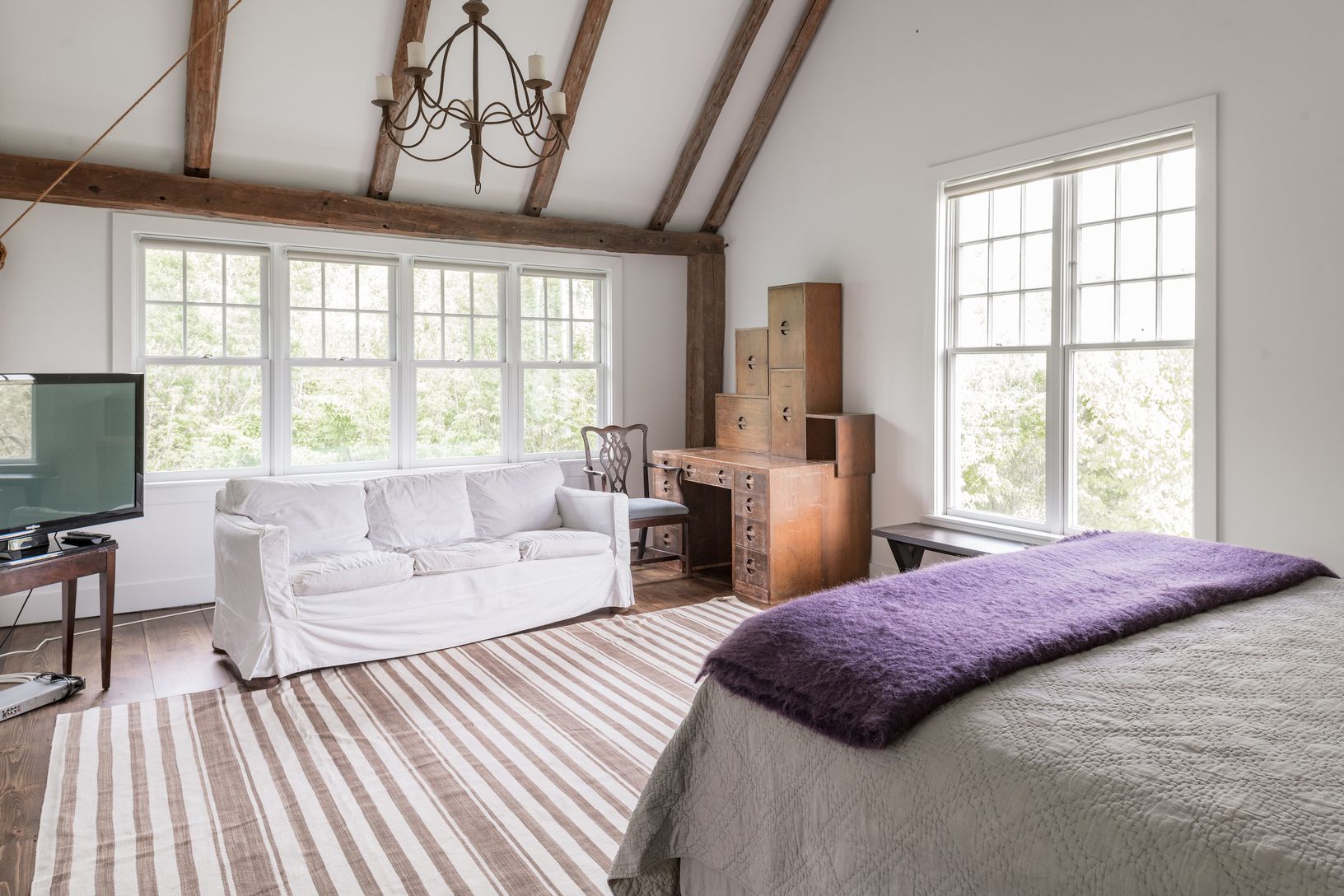  VAULTED MASTER SUITE WITH DISTANT GLIMPSE OF OCEAN