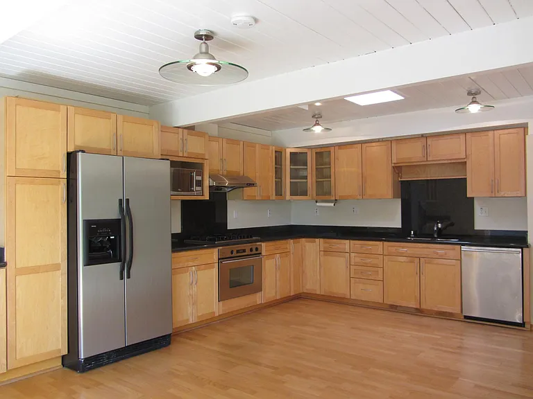 modern kitchen with new ovens, dishwasher and refrigerator