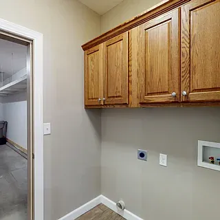 Laundry room off garage with washer dryer hook ups