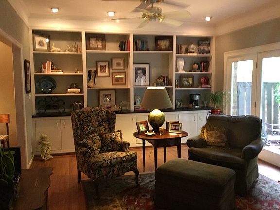 Tremendous Built ins
						:
						Den has large book case and storage, gas log FP French doors open to patio.