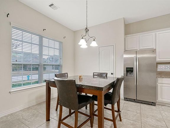 Breakfast nook located on the left side walking into the property, open to the island kitchen