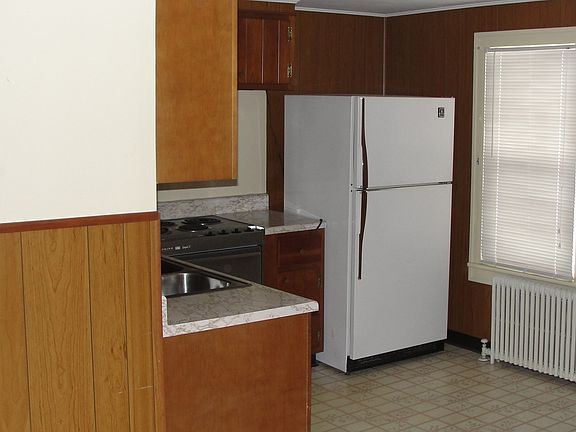 Kitchen w refrigerator and has walk in pantry